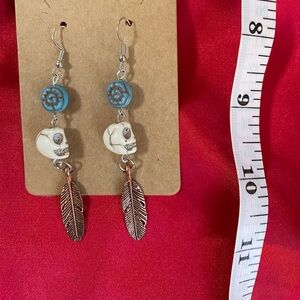 Skull and rose gold dangle earrings